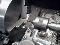 2013-12-02 15.09.32  Used the lathe to true up and put a little lip on a chunk of aluminum to fill the old hole.